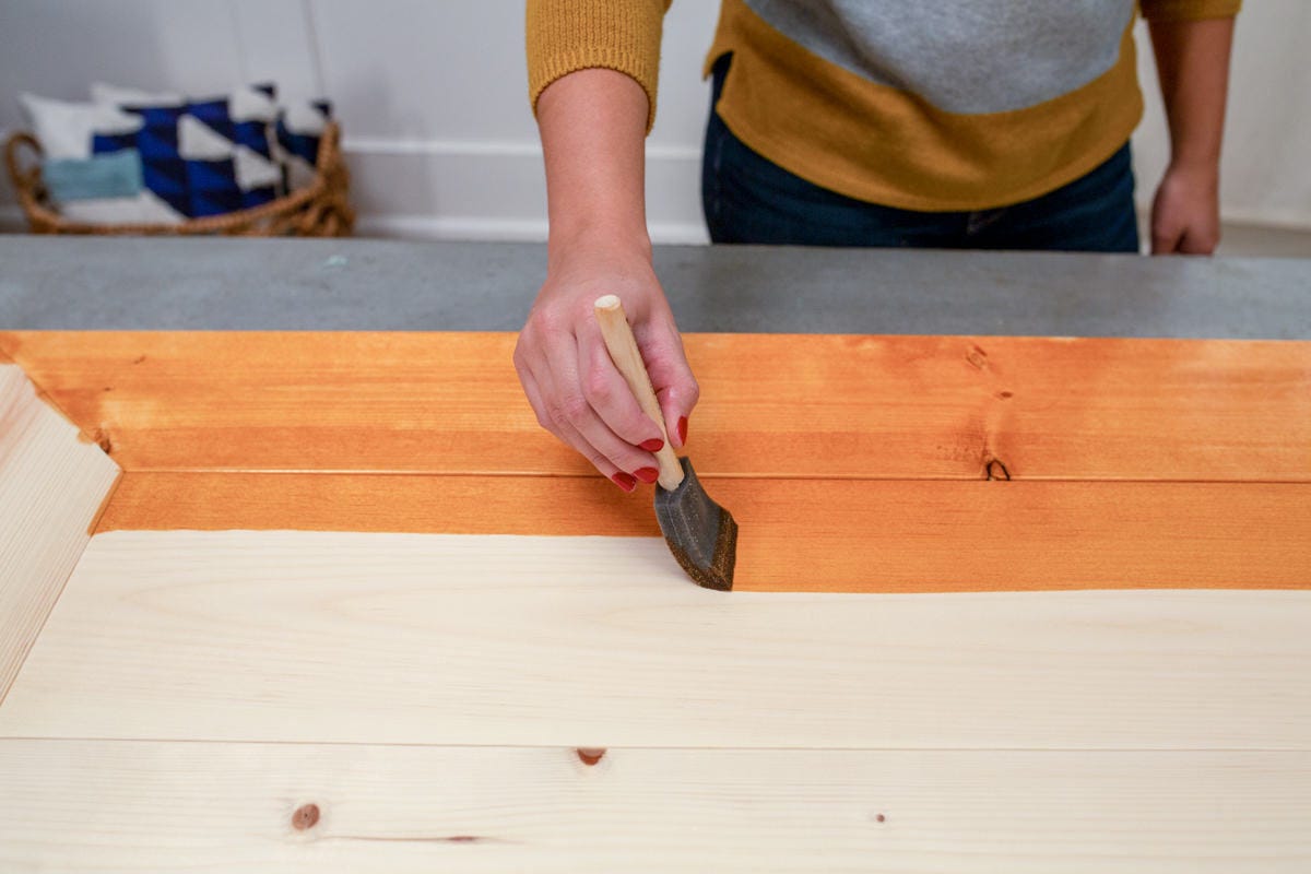 Apply stain in the direction of the wood grain