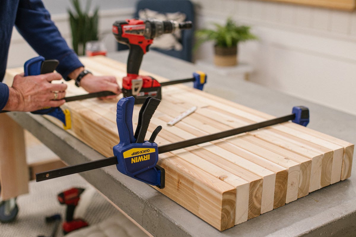 Clamping stack of 11 boards together.