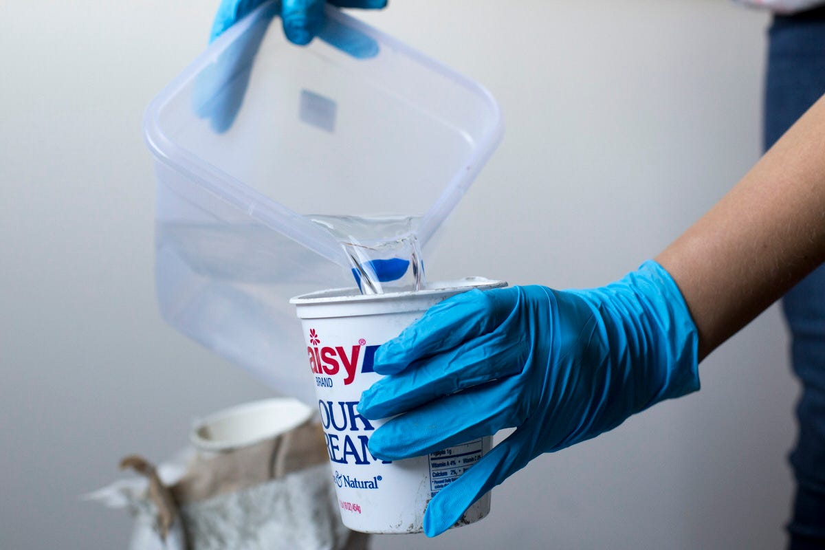 pouring water into cement mix