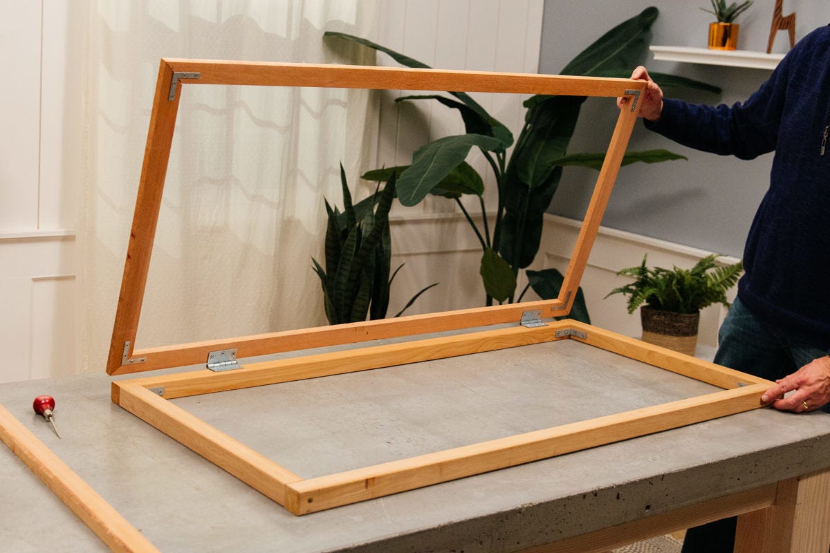 DIY decorative utility screen frame and back frame attached with two hinges.
